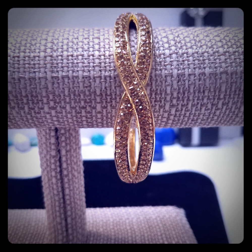 Knotted gold and crystal bangle